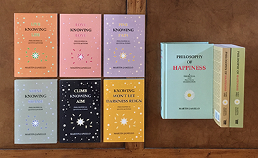 Hard- and soft-cover books by Martin Janello on philosophy of happiness. Titles are "Philosophy of Happiness" and the 6-book "Knowing" series.