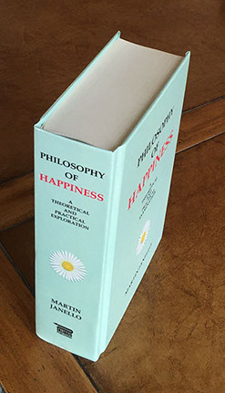 Photo of the Philosophy of Happiness book hardcover taken from above the right back corner showing top, spine, and cover.